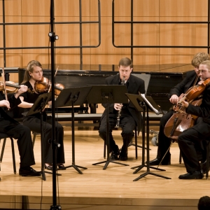Dr. Krebs performing Miniatures by Vivian Fung with the President's String Quartet