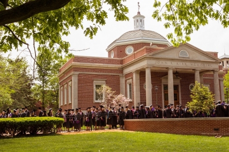 The processional marching around the Quad on the way to Stokes Stadium Processional around the Quad on the way to Stokes Stadium