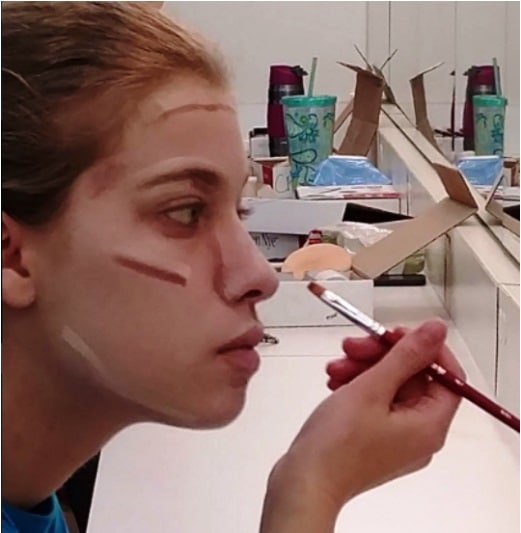 Applying theatre make-up