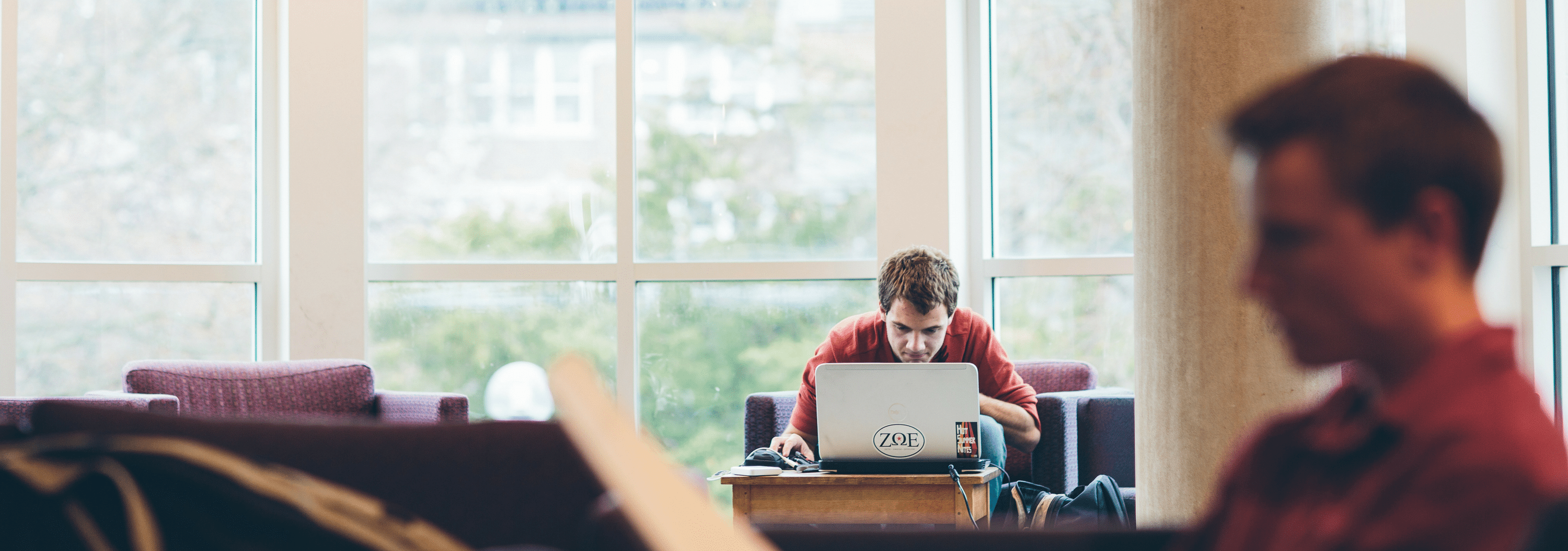 Two students studying in the library