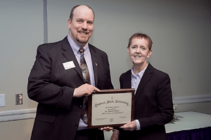 Deb Kerby presented award to Michael Barnes