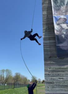 Student rappelling down a Rappel Tower